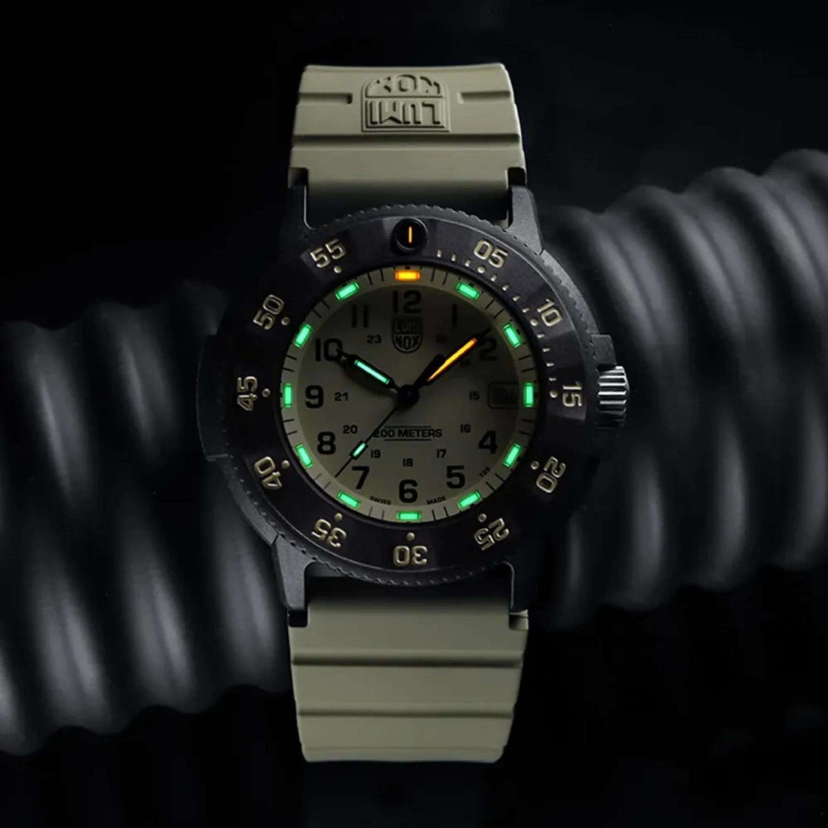 Luminox Sea Original Navy SEAL 3000 Evo XS.3010.EVO.S dive watch with glowing tritium tubes mounted on a ribbed display block