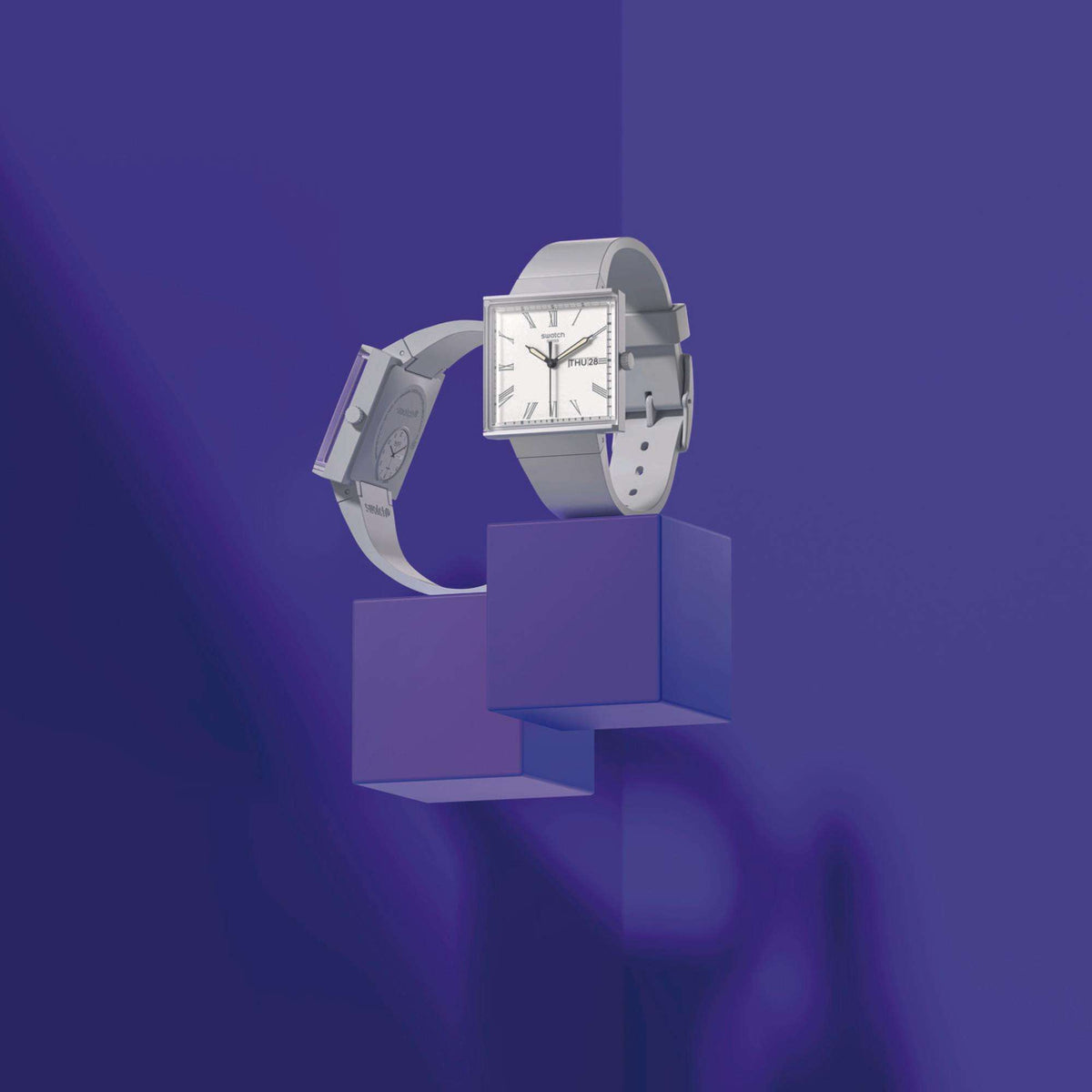Square bioceramic watch with white dial, gray strap, black hands and markers