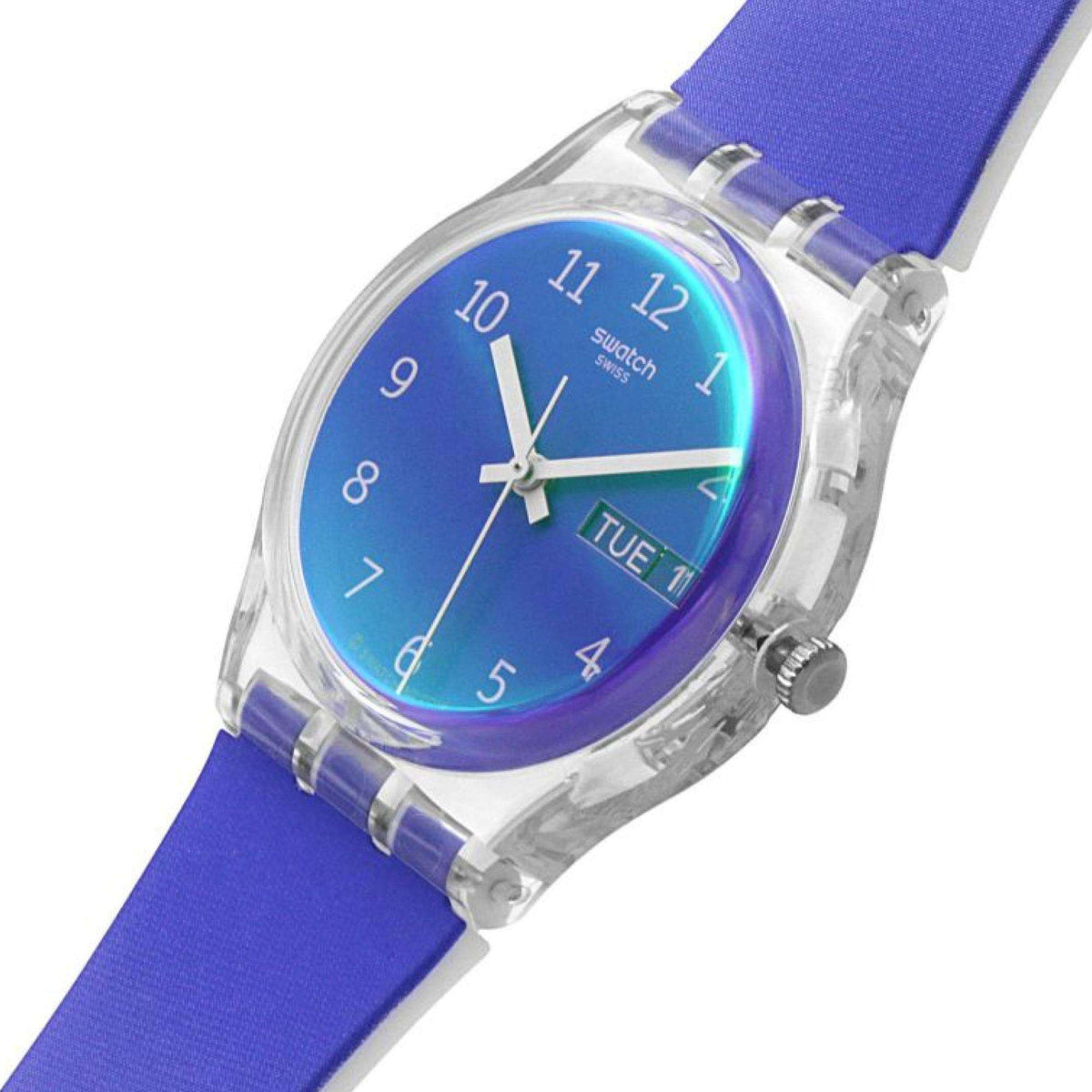 Swatch gradient dial wristwatch with gold-tone bezel, white numerals, and date