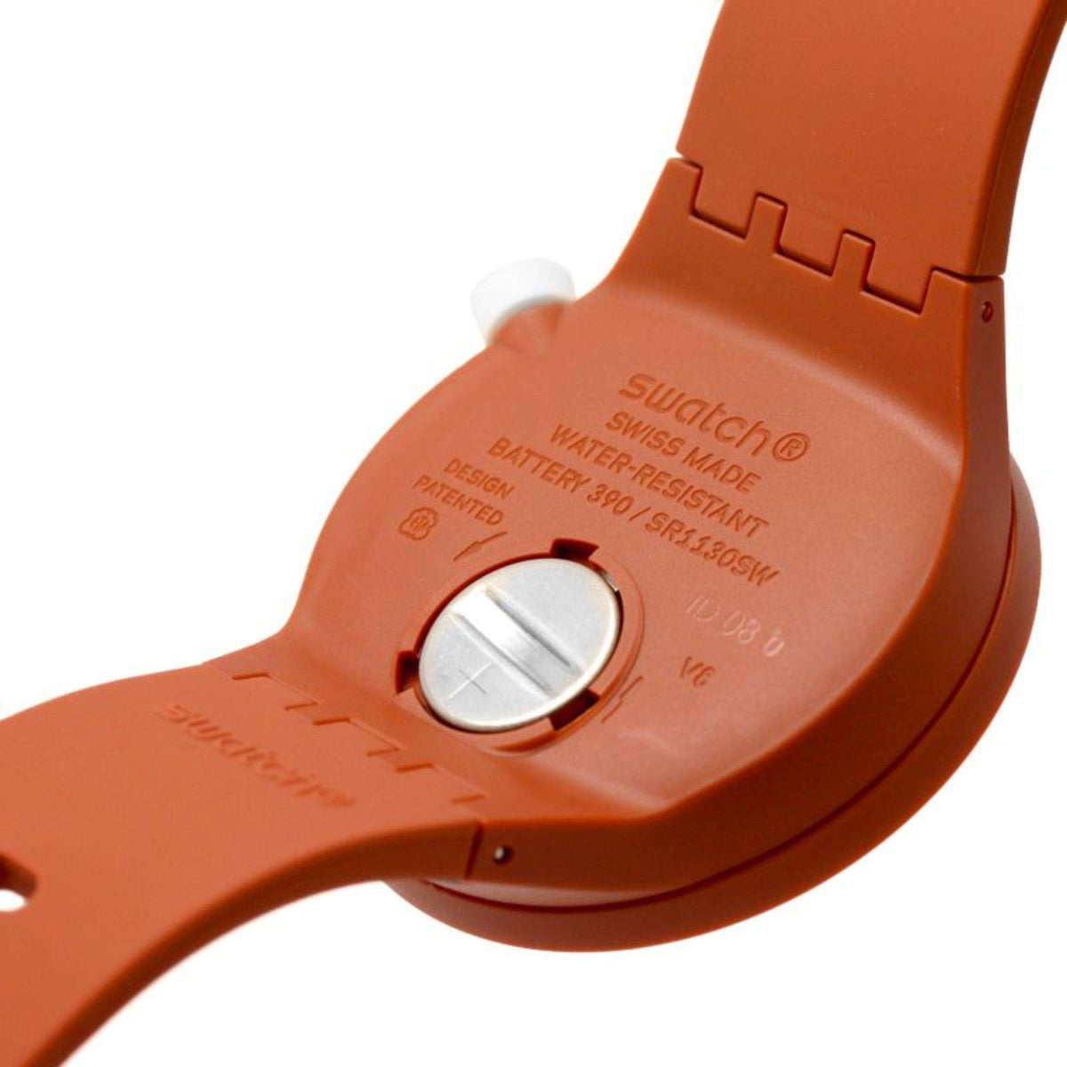 Orange Swatch watch back with water-resistant text and silver snap button