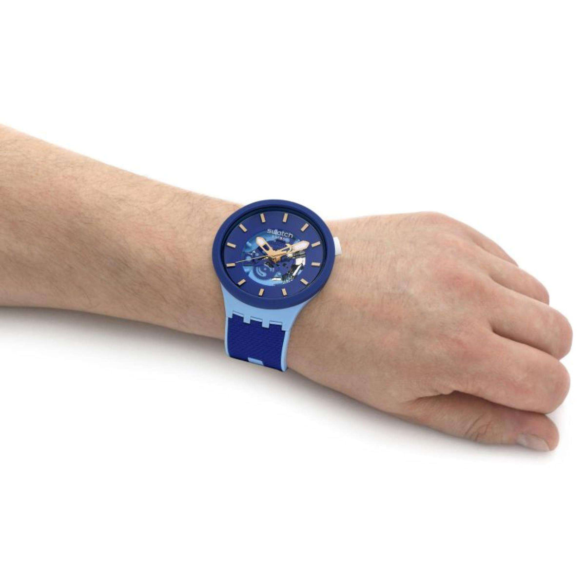 Blue dial Swatch Big Bold watch on forearm with textured blue fabric strap