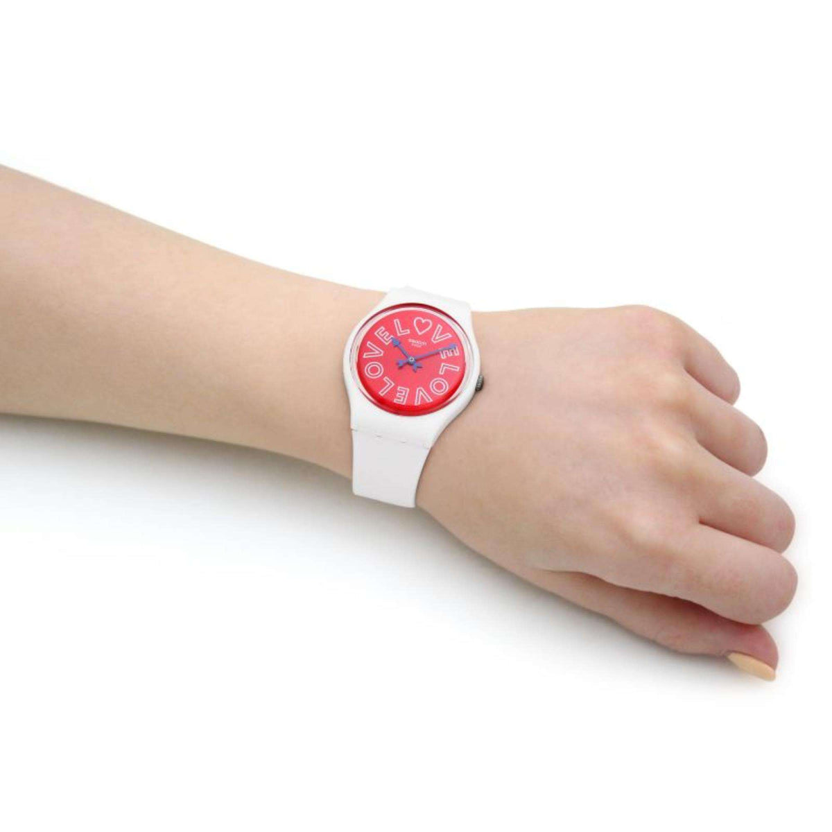Swatch PUREST LOVE gent watch on wrist, side view showing white strap and red face