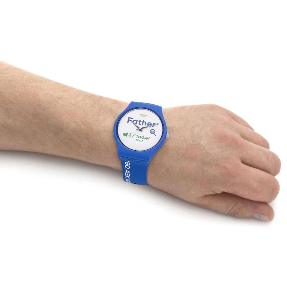 Blue silicone Swatch watch on wrist with Father graphic white dial.