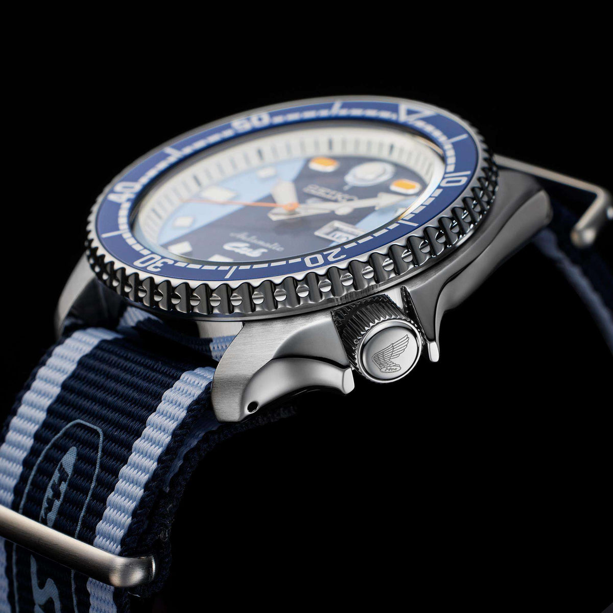 Stainless diver-style watch case with knurled bezel and blue-white NATO strap