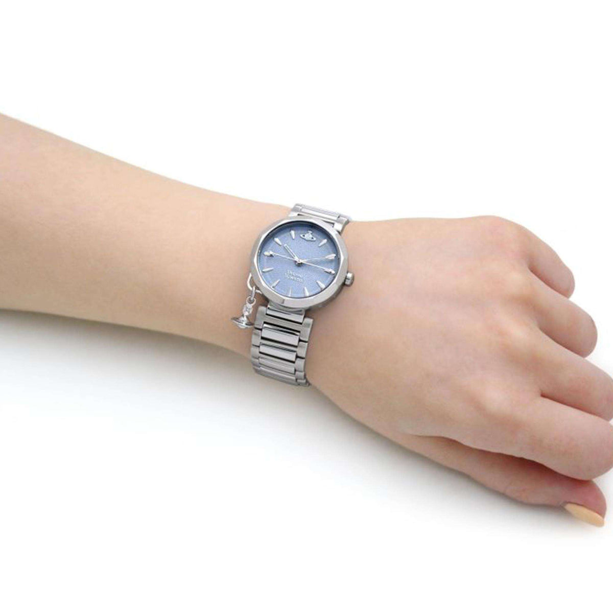 Vivienne Westwood Poplar quartz watch on hand, blue dial with stainless steel bracelet.