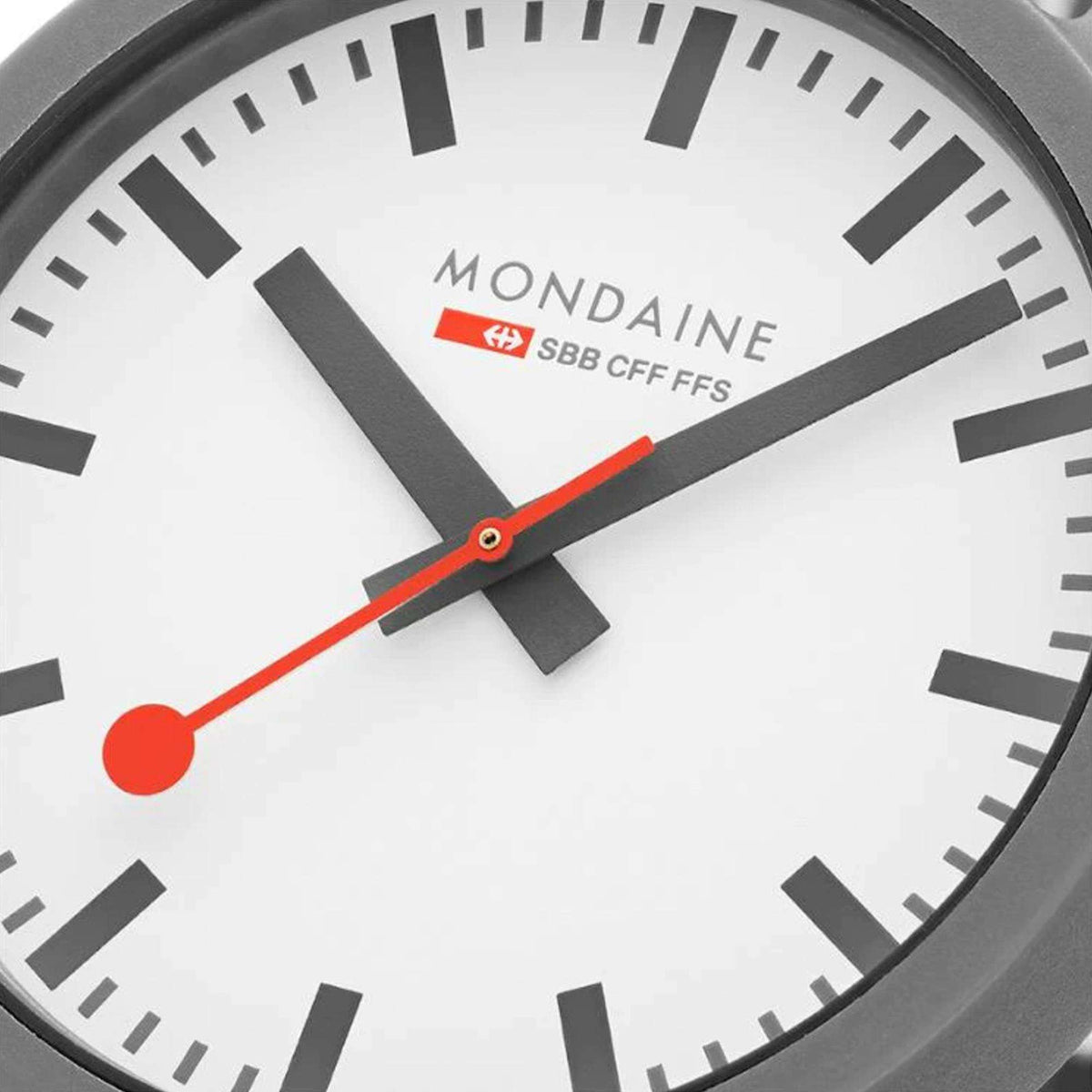 Close-up of unisex watch dial: white face, black markers, and red seconds hand.