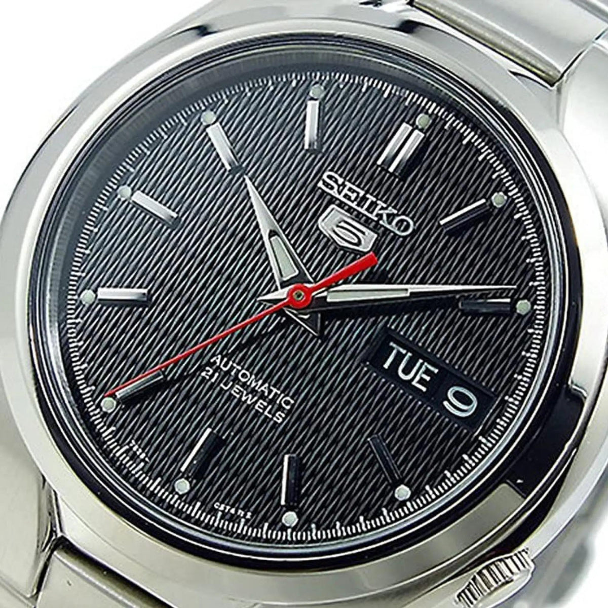 Seiko 5 Automatic SNK607K1 angled view of black dial featuring stainless steel casing