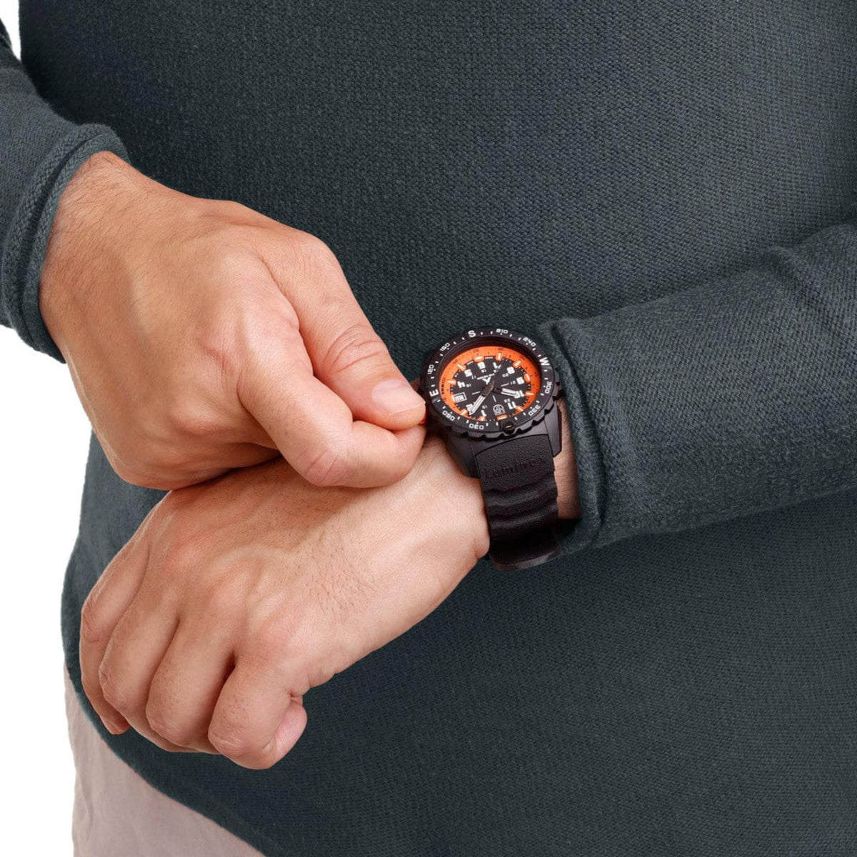 Men's black dial quartz wristwatch with orange markers and black rubber strap