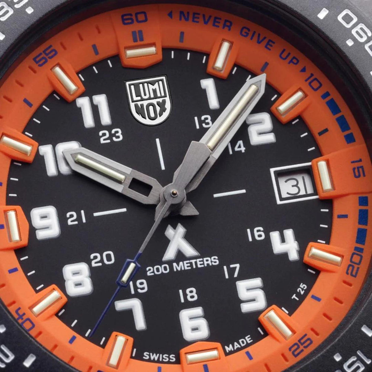 Orange dial face detail with LUMINOX logo, silver hands, orange bezel track, date window.
