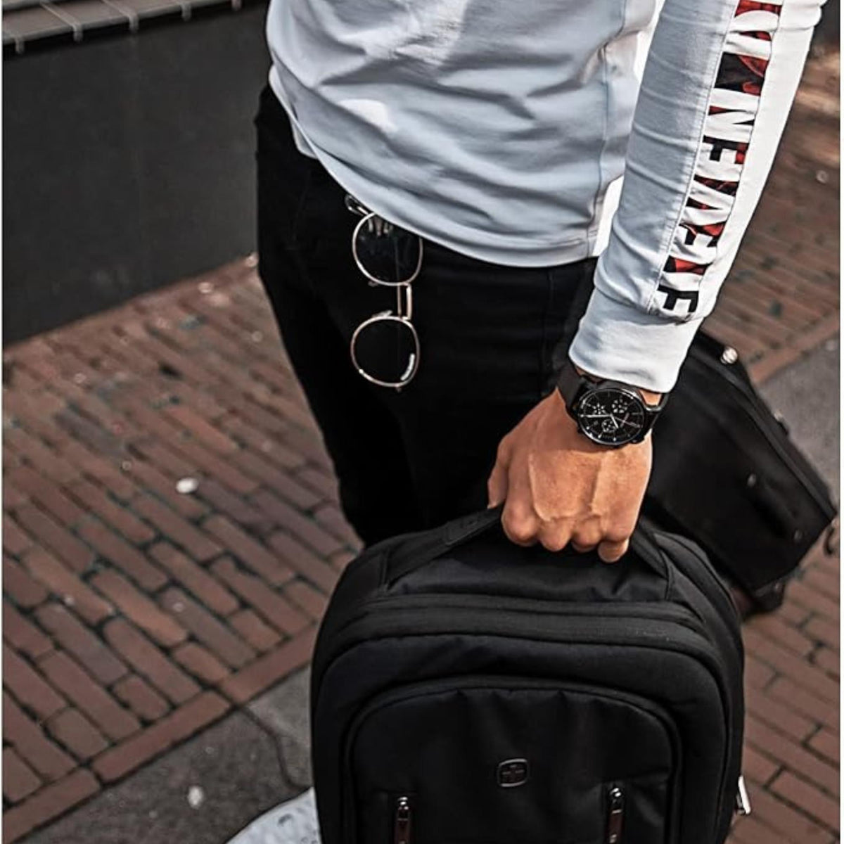 Men's Wenger chronograph watch on wrist, black dial and black mesh strap
