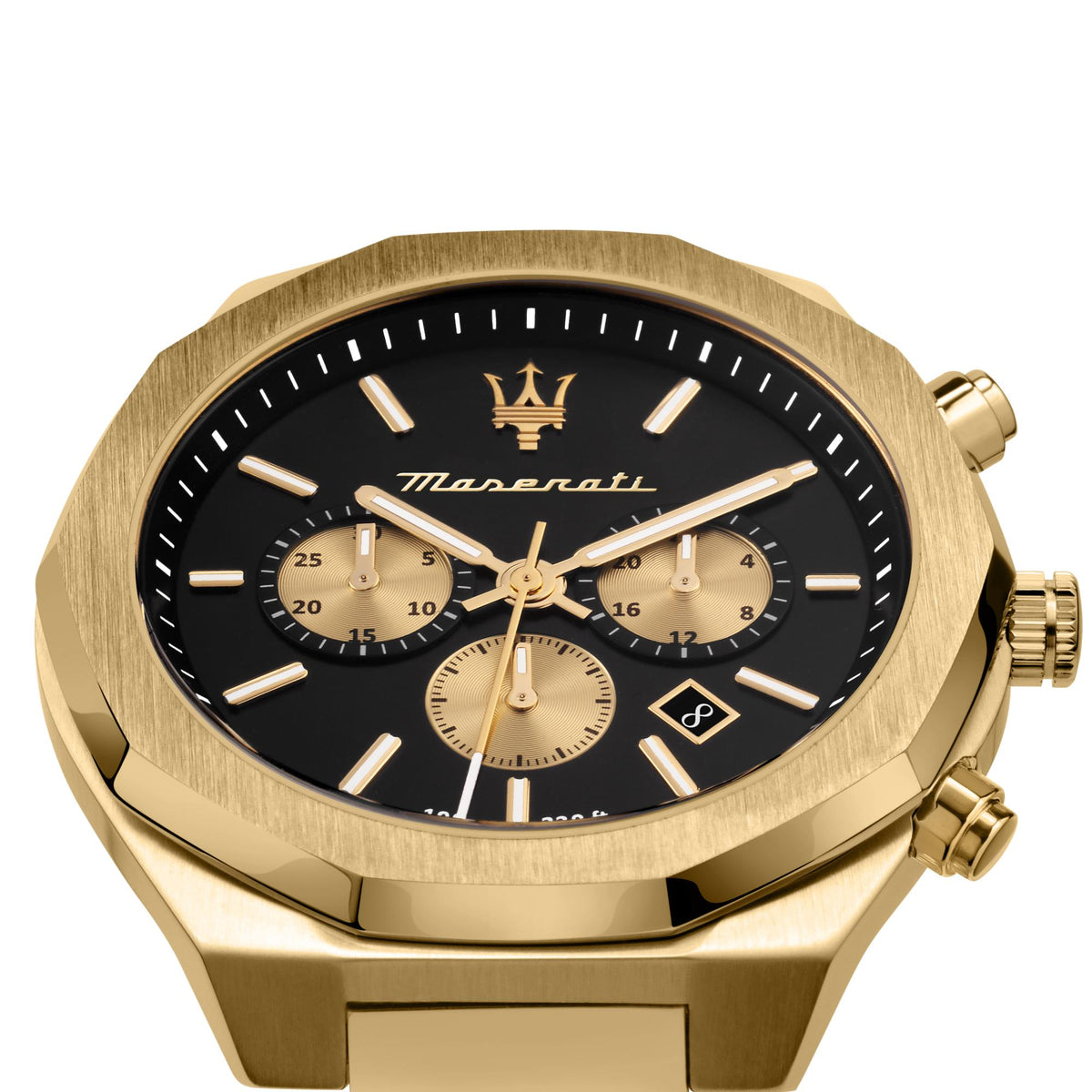Close-up of gold Maserati chronograph watch dial with black face and three cream subdials