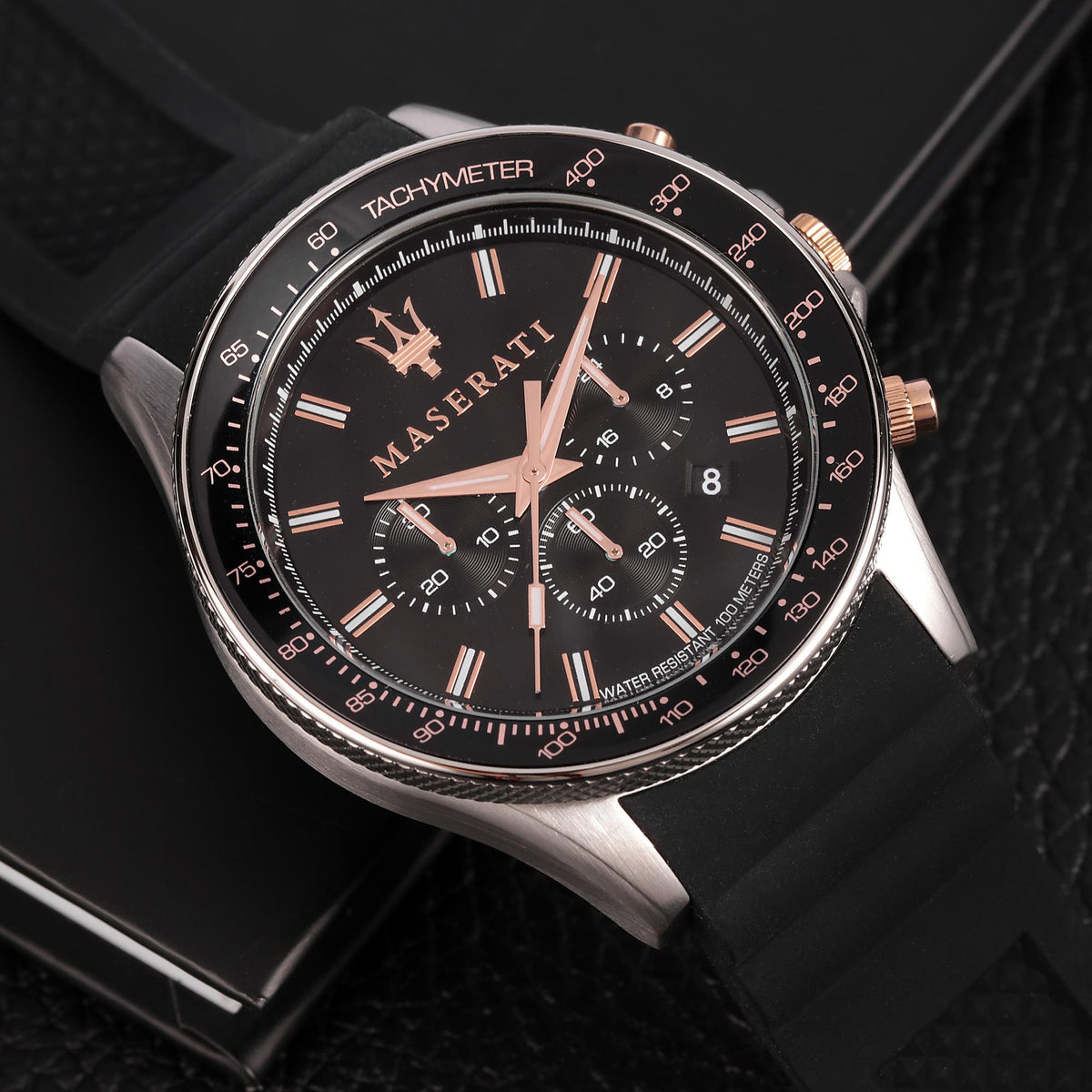 Men's Maserati chronograph dial close-up with black subdials and rose-gold hour markers