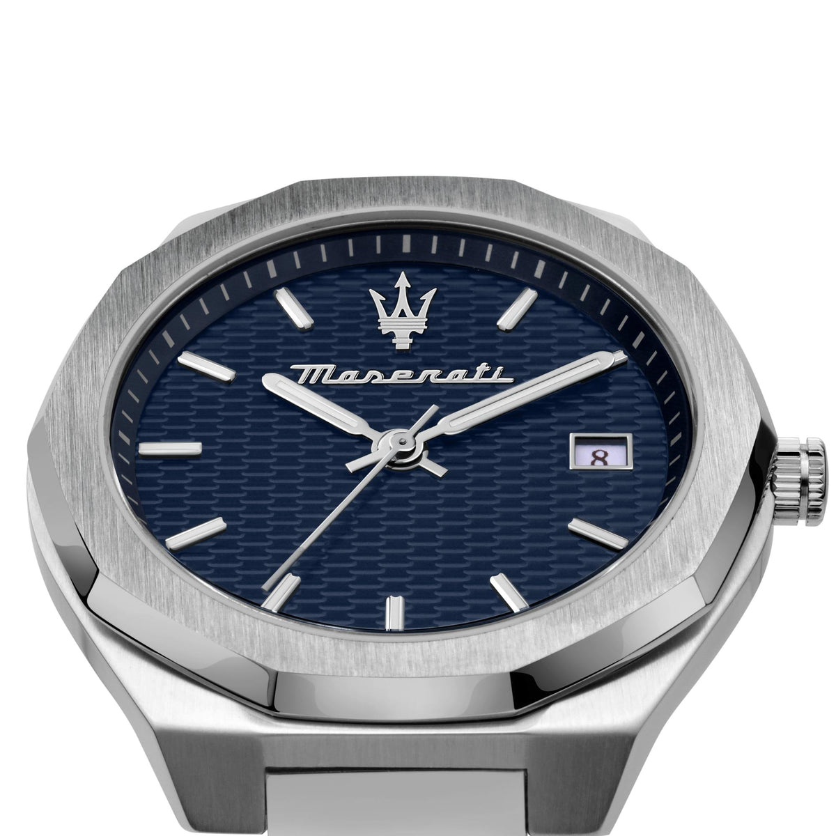 Close-up of blue textured dial with silver hands, crown, and date window
