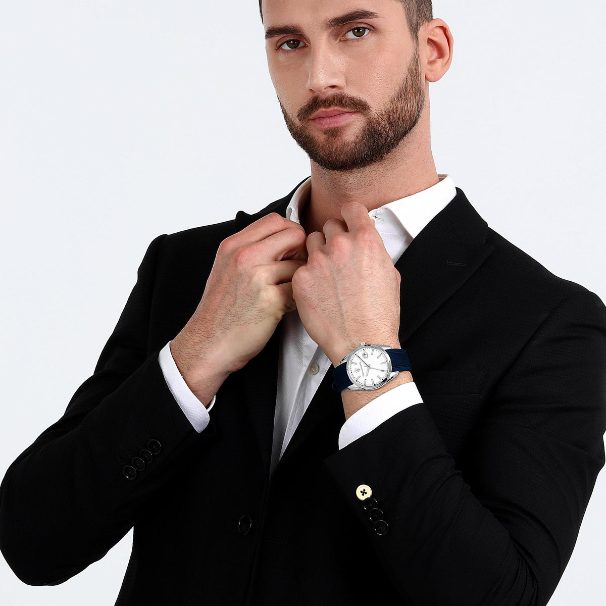 Men's Maserati quartz watch on man's wrist, white dial and blue silicone strap