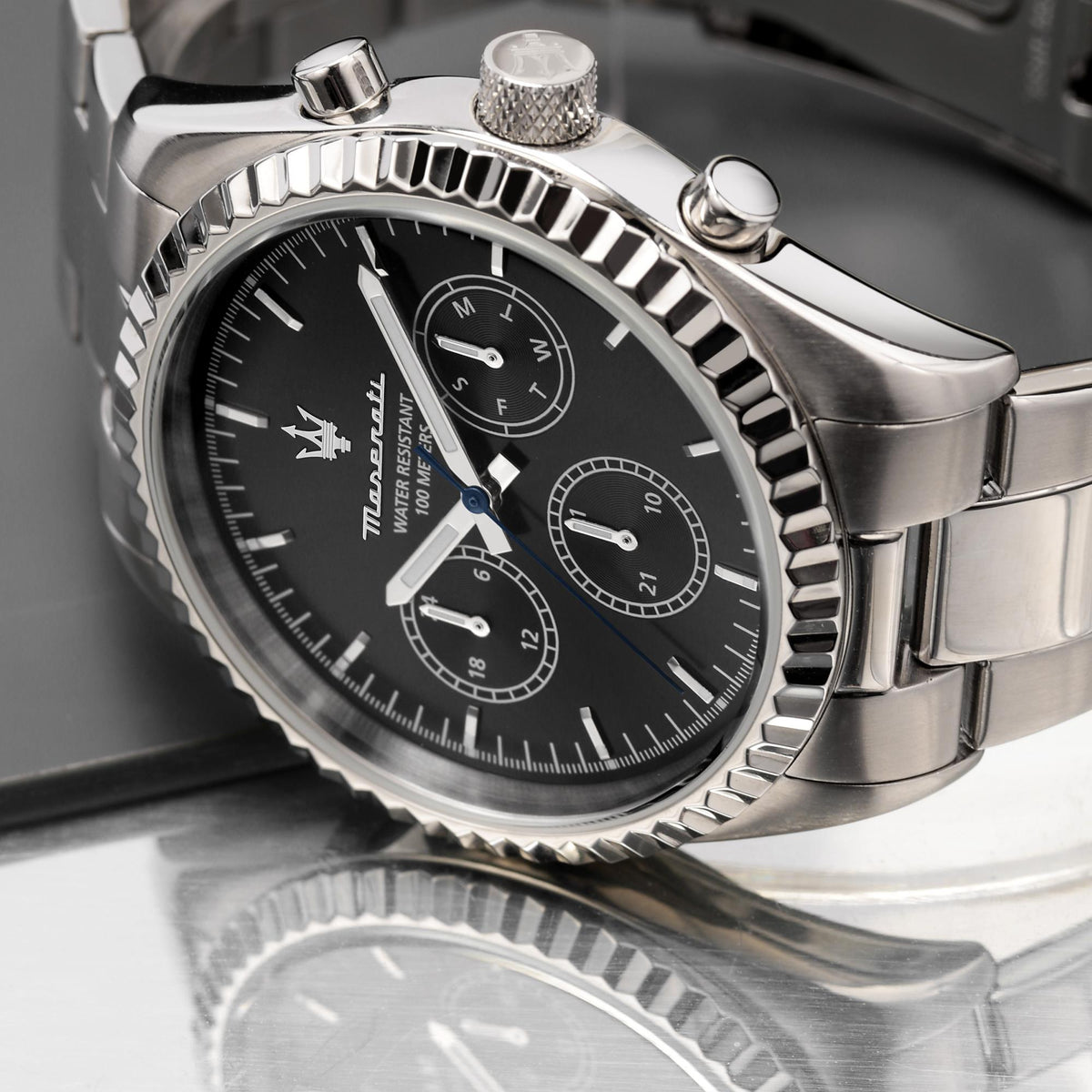 Maserati chronograph watch close-up, black dial and steel bezel with crown