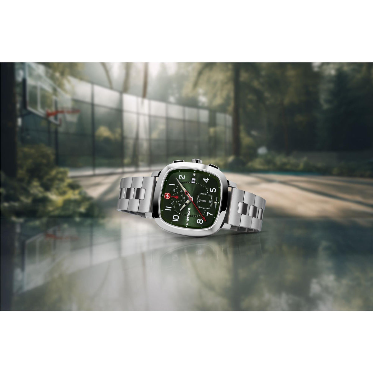 Stainless steel wristwatch with green dial and metal bracelet, shown at an angle