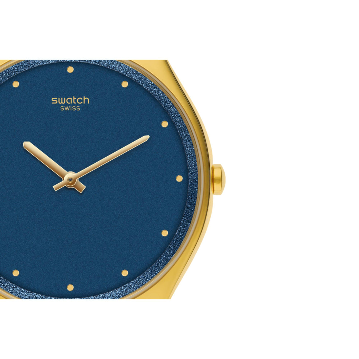 Close-up of blue dial watch with gold hands, dot markers, and gold-tone bezel
