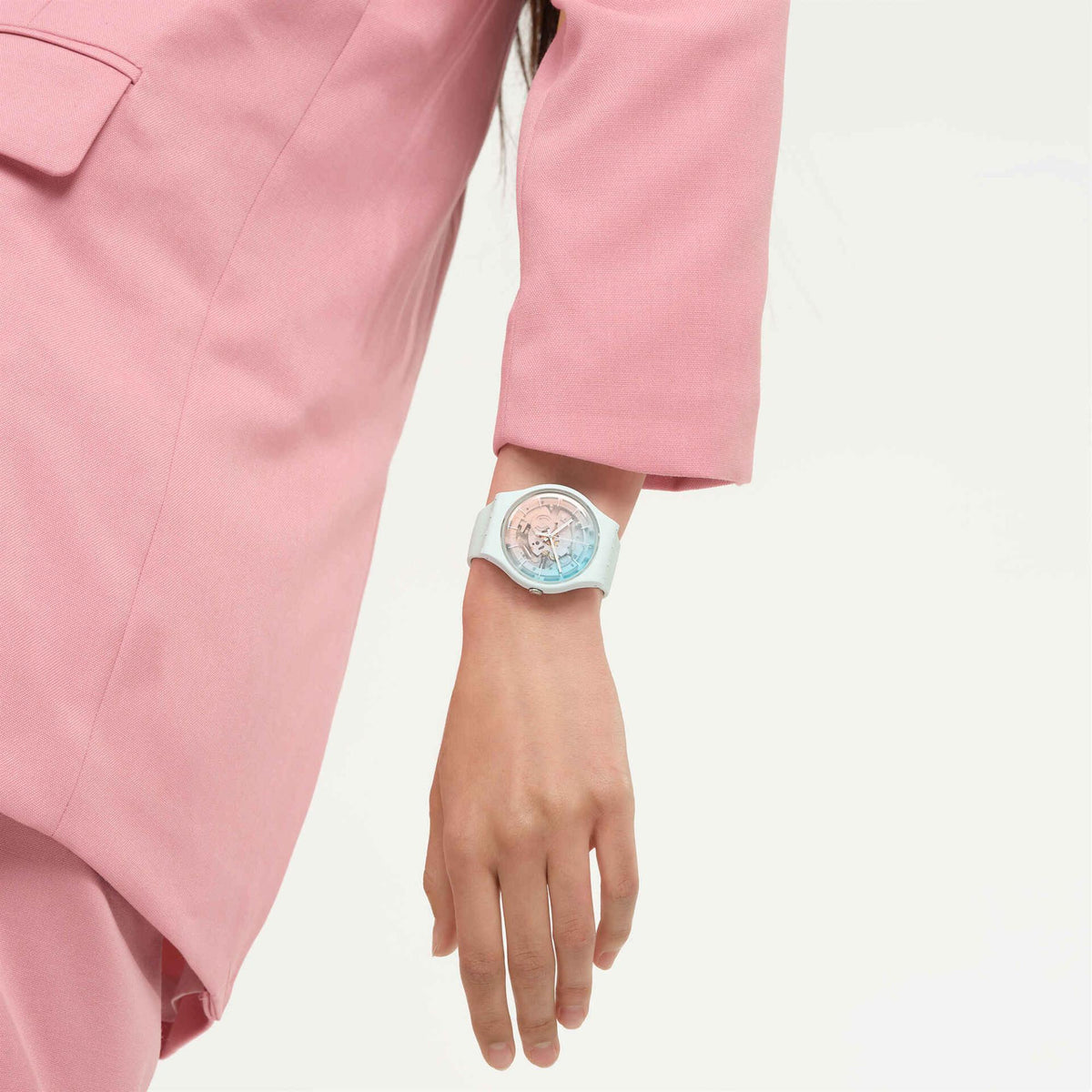 Unisex mint silicone watch on hand with ice-blue dial and pink-toned inner details