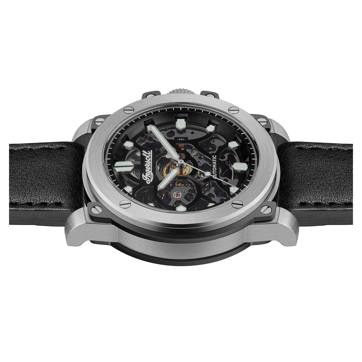 Automatic skeleton watch frontal close-up with black dial, silver bezel, and visible movement