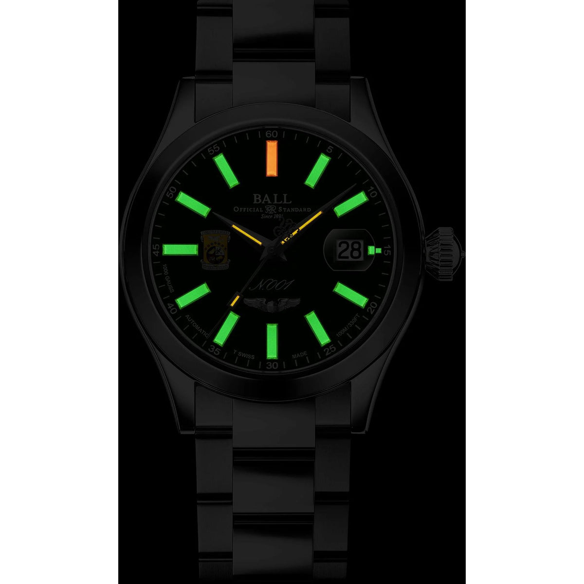 Men’s black-tone automatic watch with green-glow dial, date window at 28 and crown