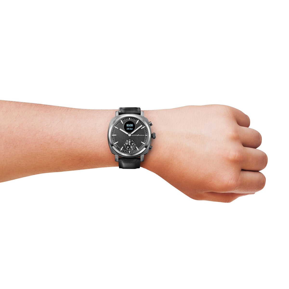 Hybrid smart watch on wrist with black leather strap and dark slate dial