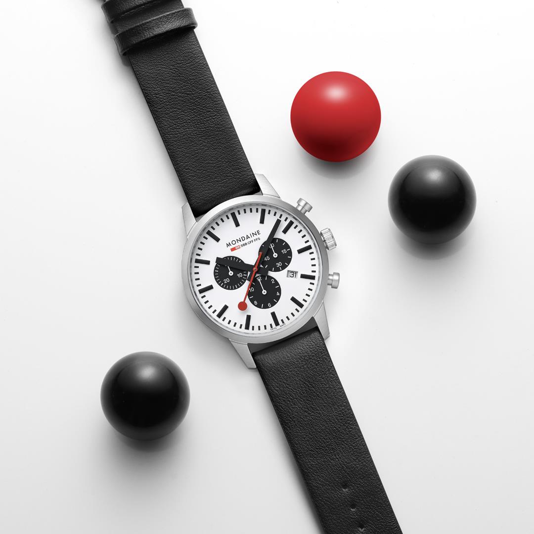 Mondaine Neo MSD.41410.LBV overhead shot showing white dial set on a decorative background