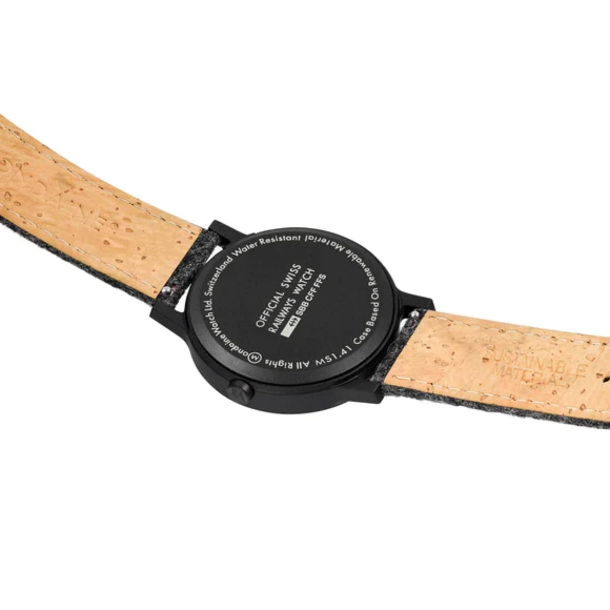 Men's Mondaine watch caseback on tan strap with printed markings