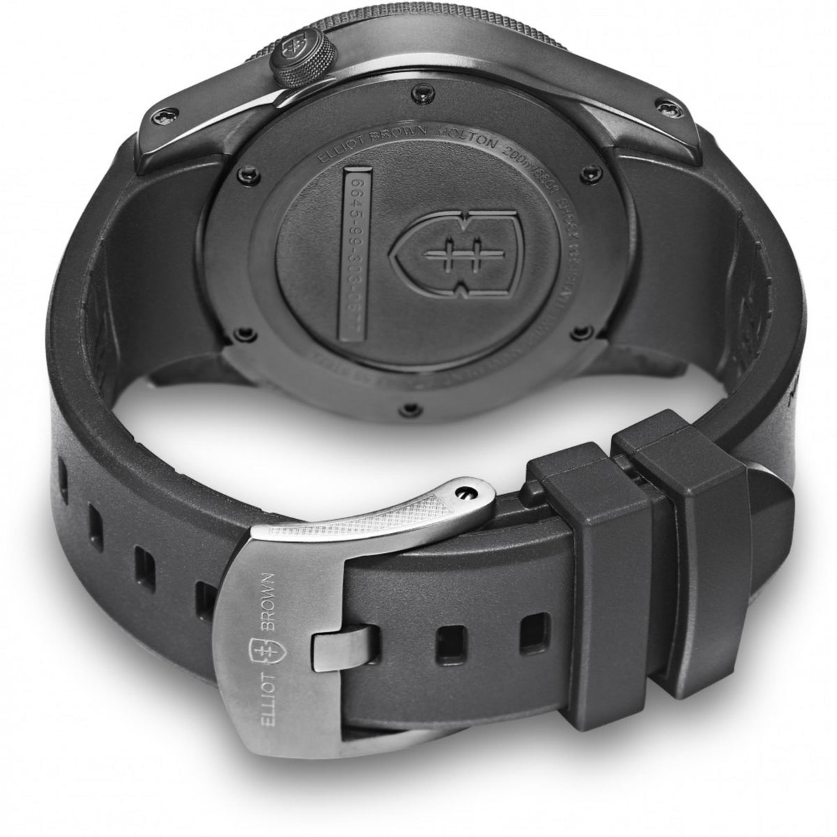 Black rubber strap watch with engraved caseback and metal crown, side profile view