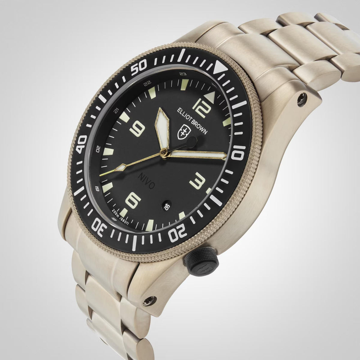 Gold-tone men’s sport watch close-up with dark green dial, bezel markers, date window