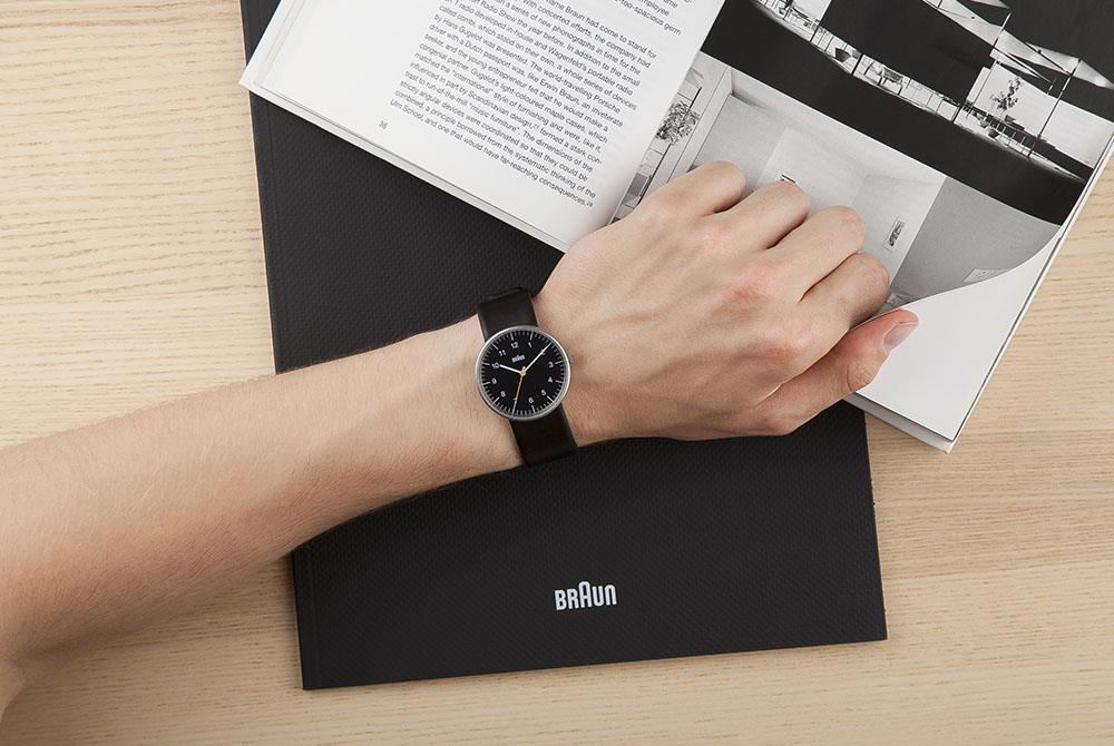 Braun quartz men's watch on wrist, black dial and black leather strap