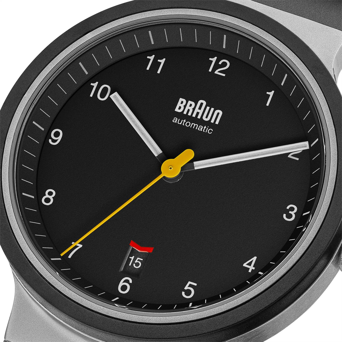 Black dial men's automatic watch close-up with yellow second hand and silver hands