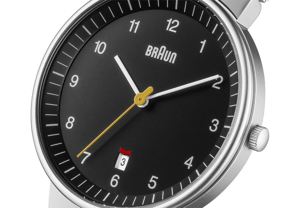 Braun men's watch with black dial, baton markers, gold-accent hands, and date window