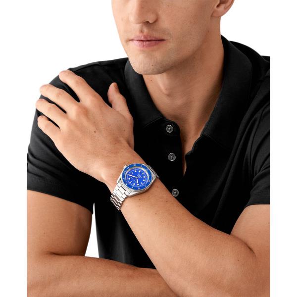 Man wearing a black polo shirt with a blue watch on his wrist.