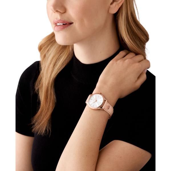 Michael Kors watch on wrist with white dial and blush pink leather strap, rose gold bezel
