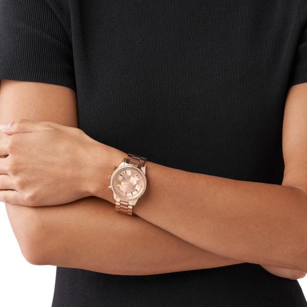 Michael Kors Bryant MK6357 ladies watch model shot view showing the rose gold tone timepiece on a wrist