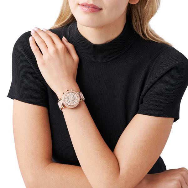 Michael Kors Parker chronograph watch on wrist with rose gold-tone steel link strap and dial