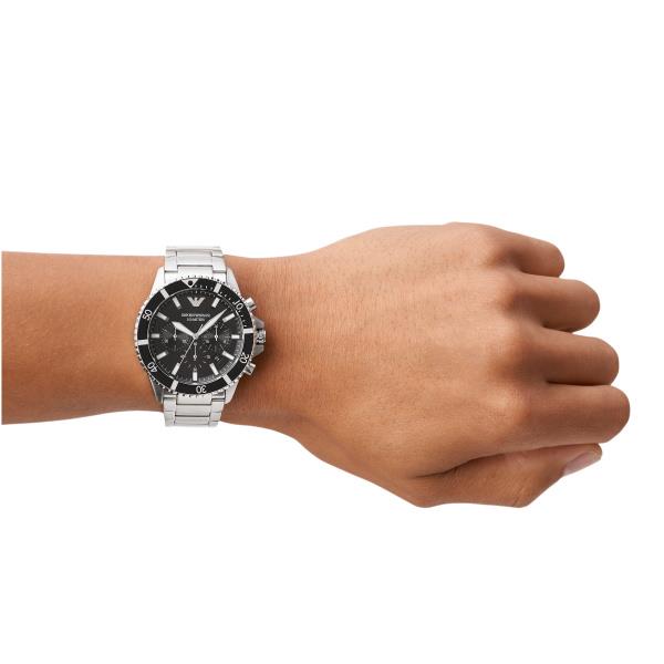 On-wrist perspective of the Emporio Armani Diver AR11360 timepiece displaying the black chronograph dial and silver-tone steel bracelet on a wrist