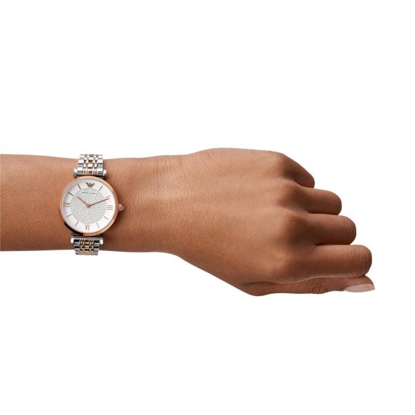 Ladies wristwatch with two-tone steel bracelet and white dial on wrist