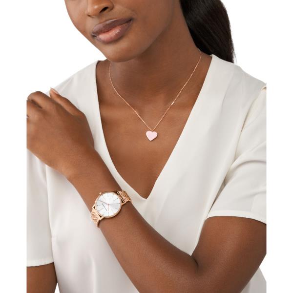 Ladies rose-gold quartz watch on wrist with white dial and logo at 12