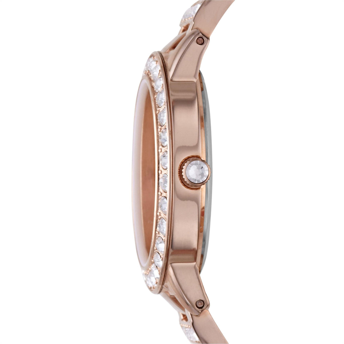Side profile view of the Fossil Jesse ES3020 timepiece highlighting the slim rose gold-tone case, crystal-encrusted bezel, and textured crown
