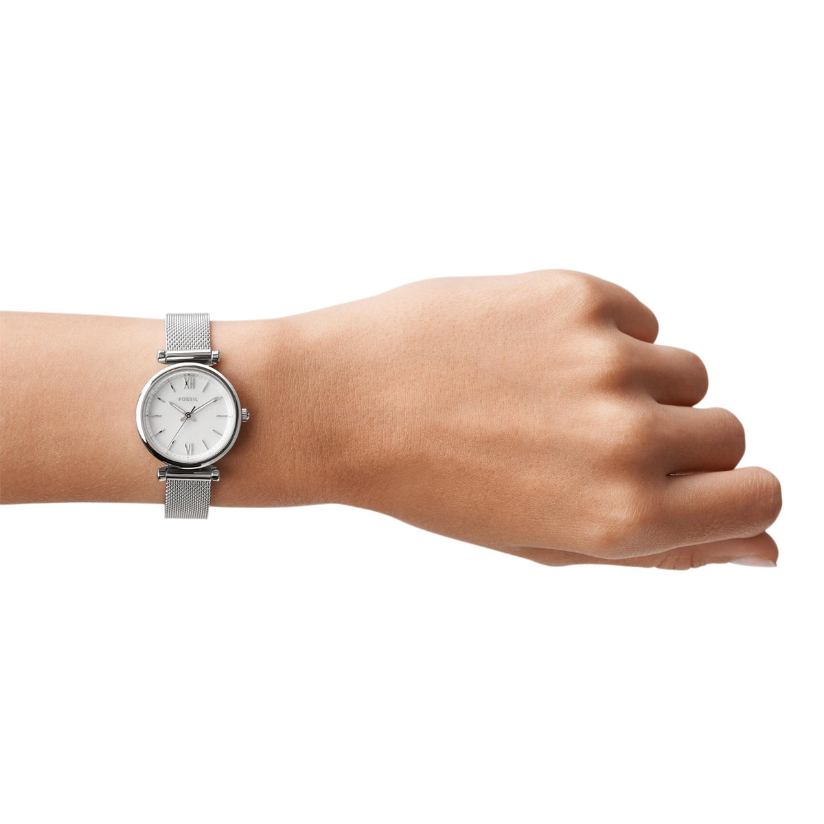 Fossil ladies quartz watch on wrist with silver mesh bracelet and white dial