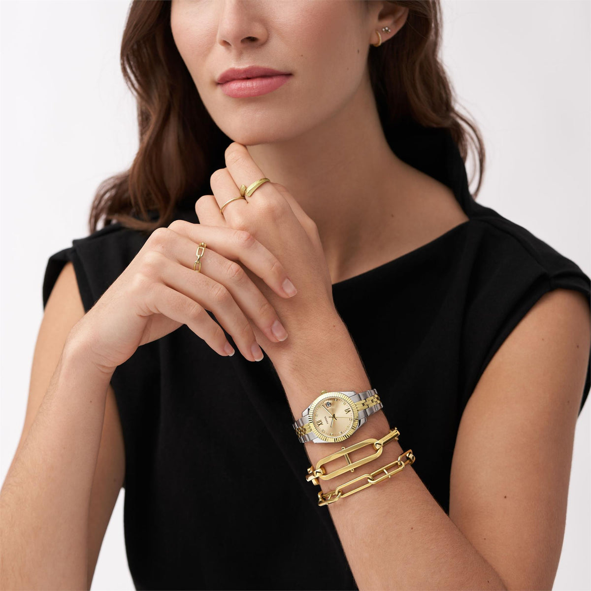 Fossil Scarlette ES4949 lifestyle view of model wearing mens quartz watch with a gold dial on wrist