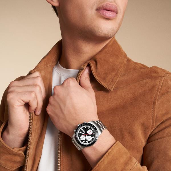Men's stainless steel chronograph watch with black dial on wrist