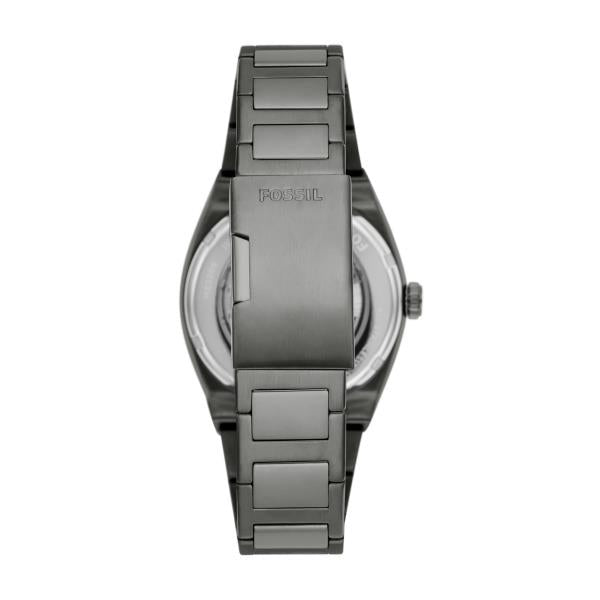 Back view of the Fossil Everett ME3206 watch detailing the gunmetal steel bracelet, exhibition case back, and engraved folding clasp