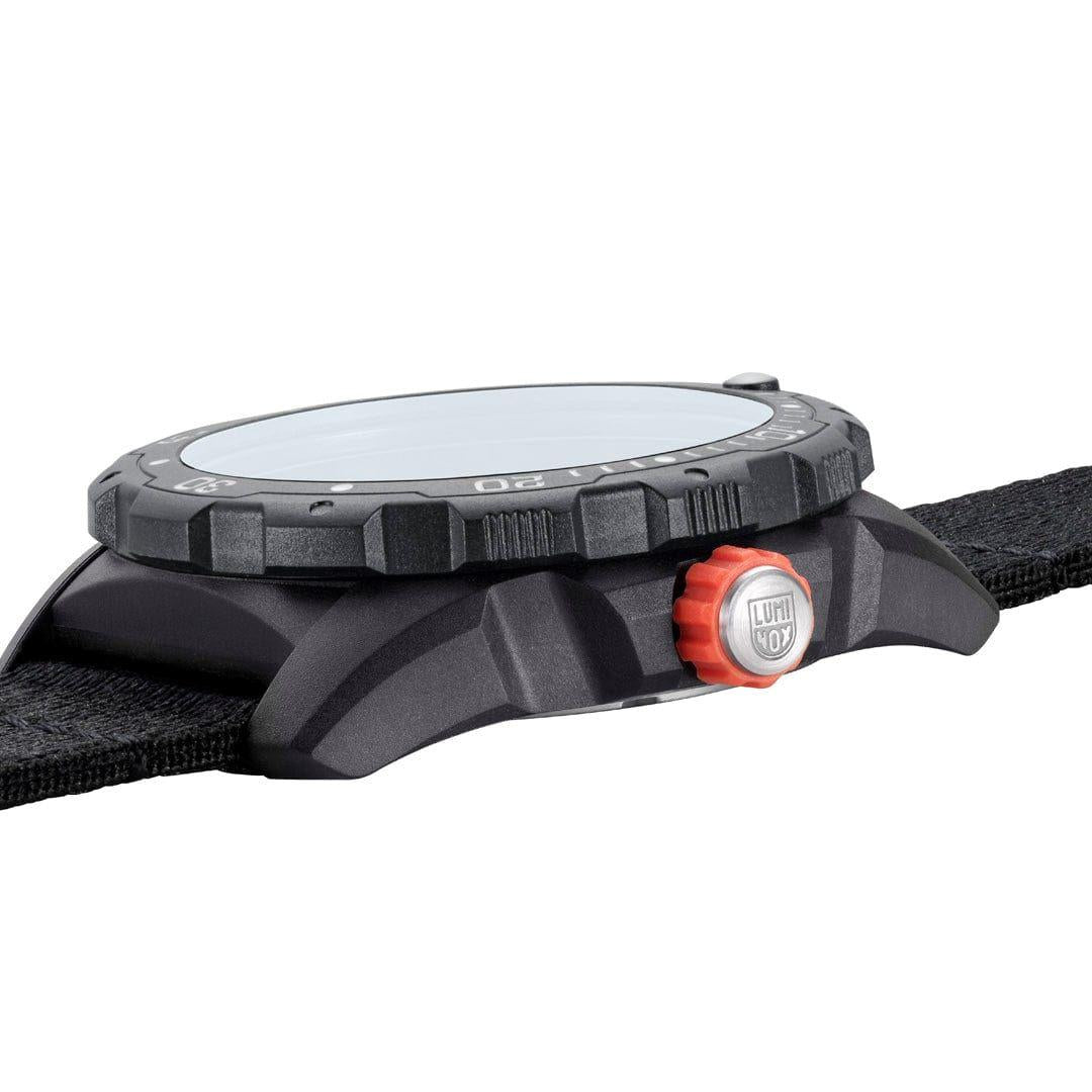 Black sports watch case side view with orange crown and knurled bezel