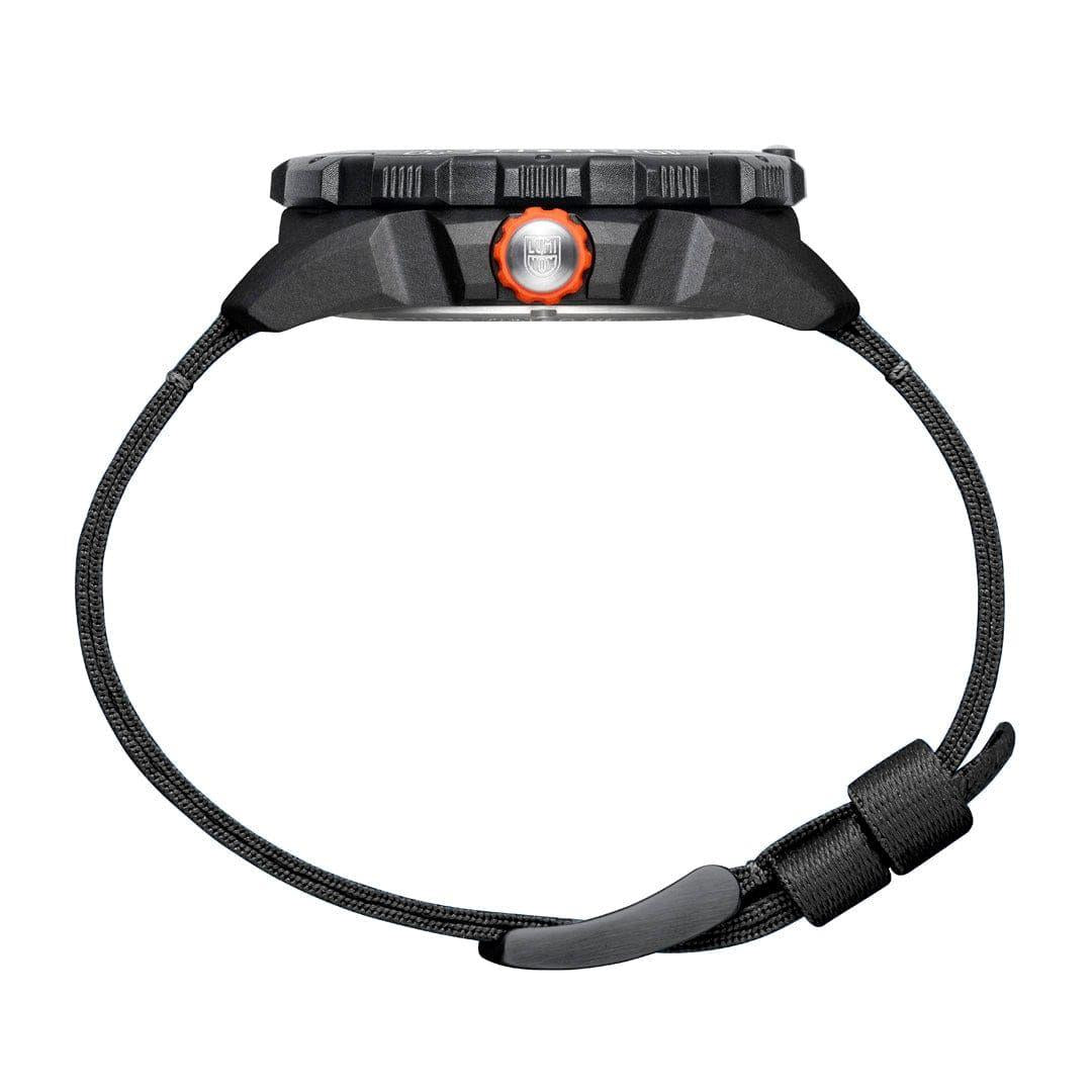 Black sports quartz watch with black fabric strap and orange crown