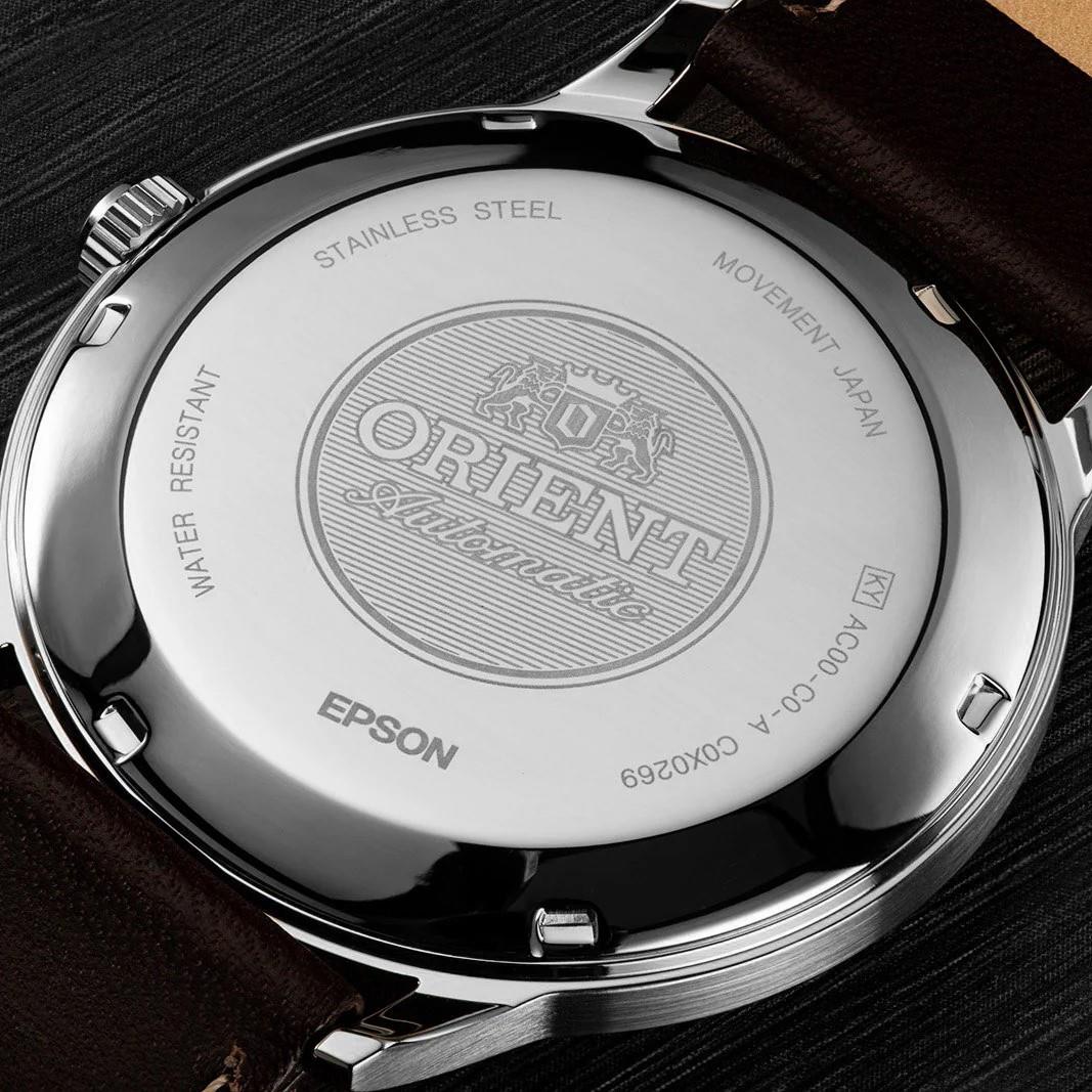 Stainless steel case back of men's automatic wrist watch engraved on brown leather strap