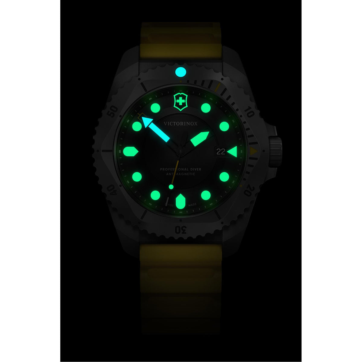 Victorinox Dive Pro 43mm watch, featuring green and blue glowing lume and a yellow strap