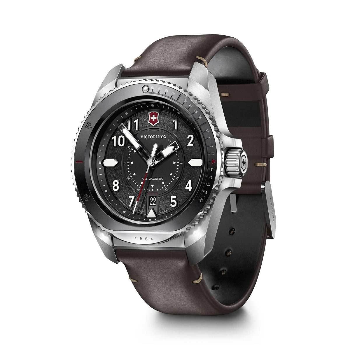 Men’s quartz wristwatch with black dial, silver case, brown leather strap and dark rubber strap.
