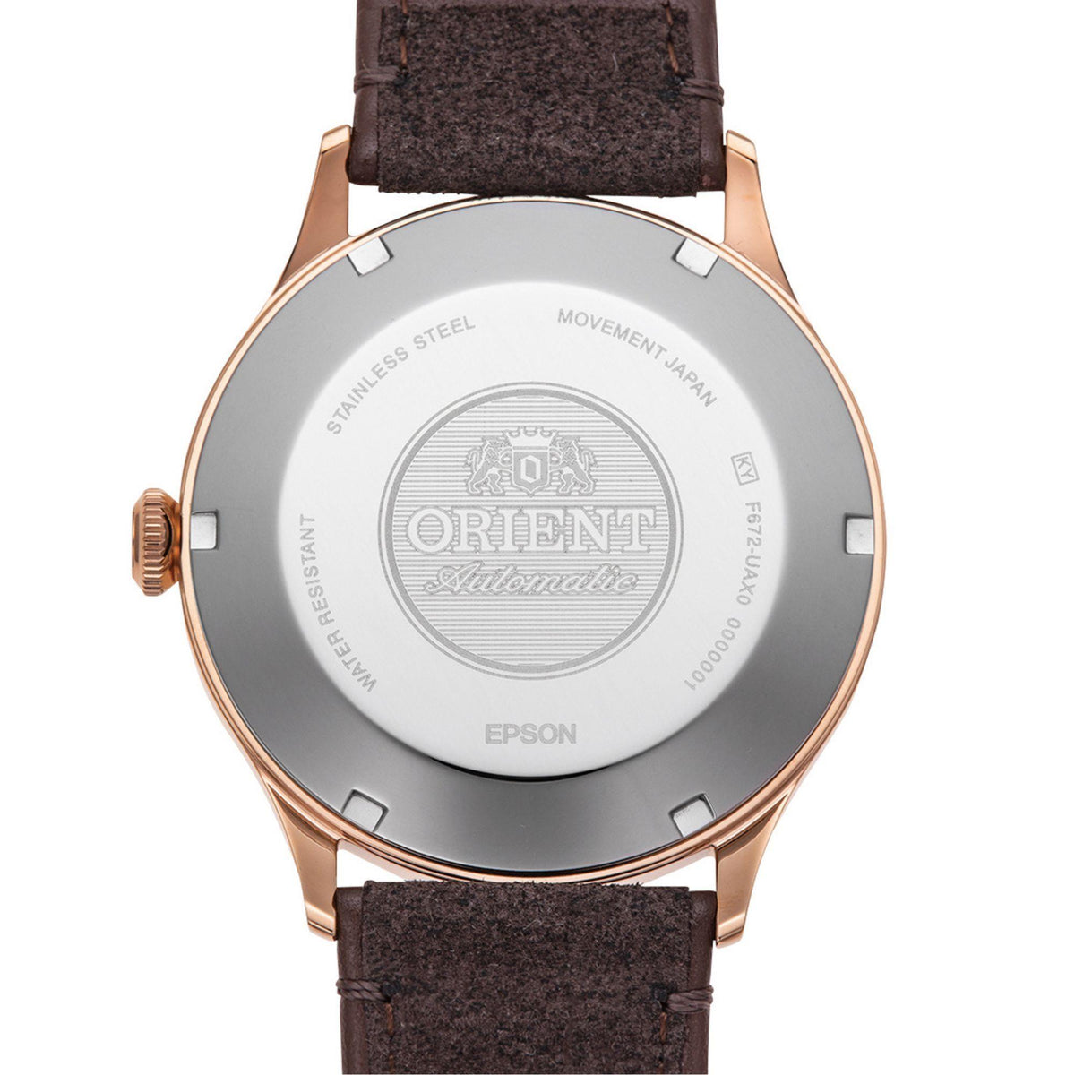 Men's bronze-tone automatic watch caseback with brown leather strap, close-up engraved seal